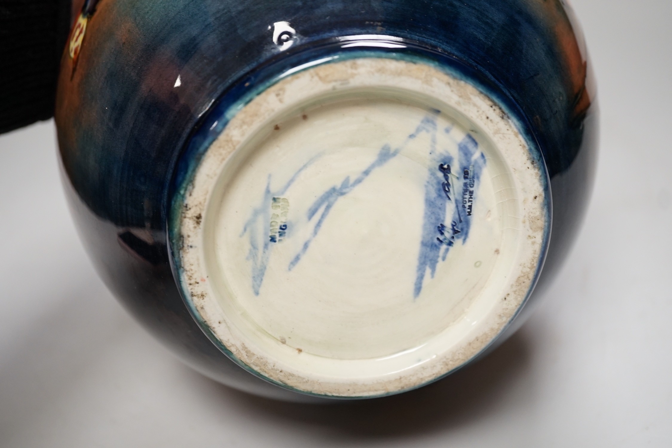 A Moorcroft flambé ‘orchid’ globe shaped vase, 21cm